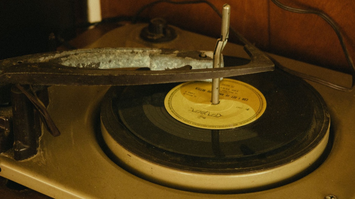 vintage record player with cracked vinyl
