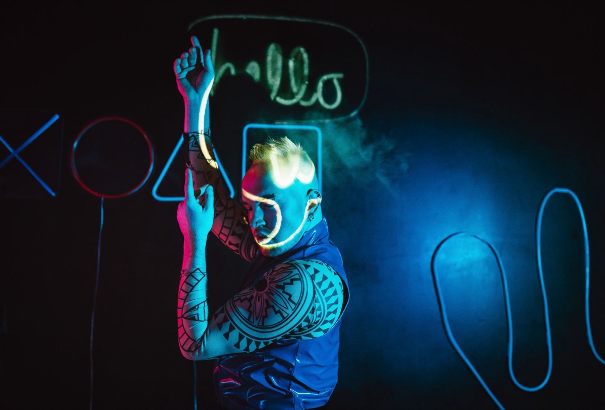 Graffiti-covered club wall with neon lighting