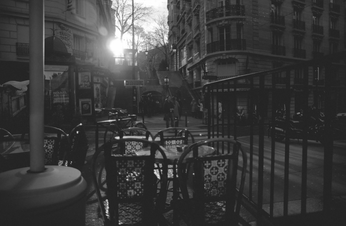 Montmartre street with a view of Sacré-Cœur, showing a quiet, historic part of Paris