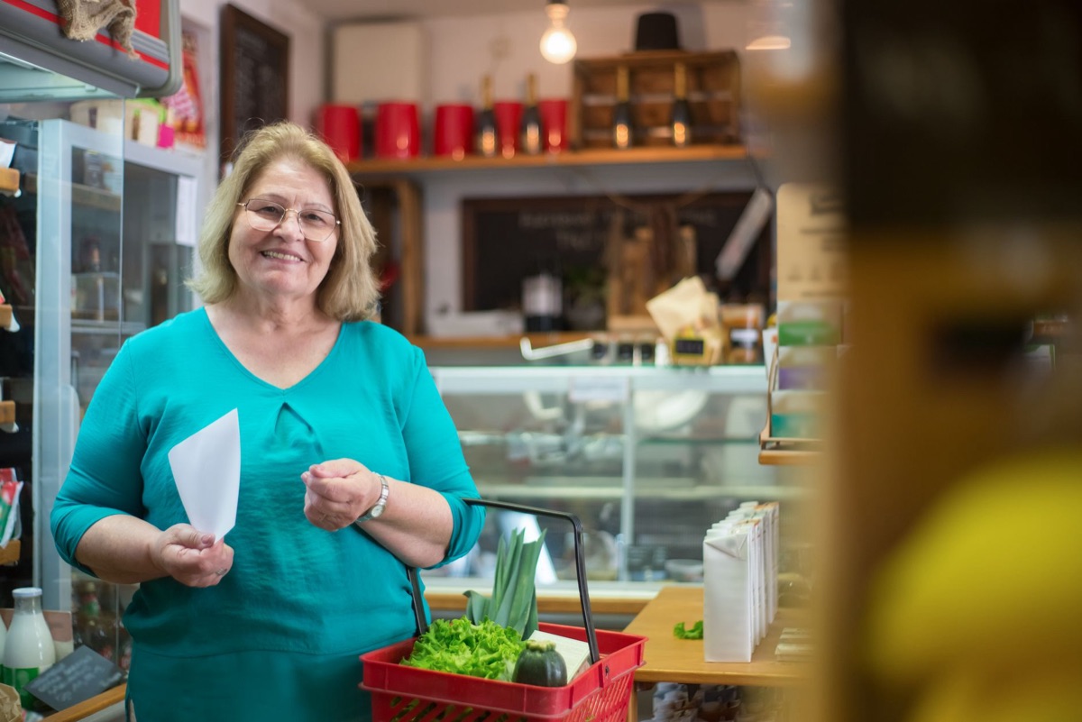 Parisian shopper with tax refund receipt