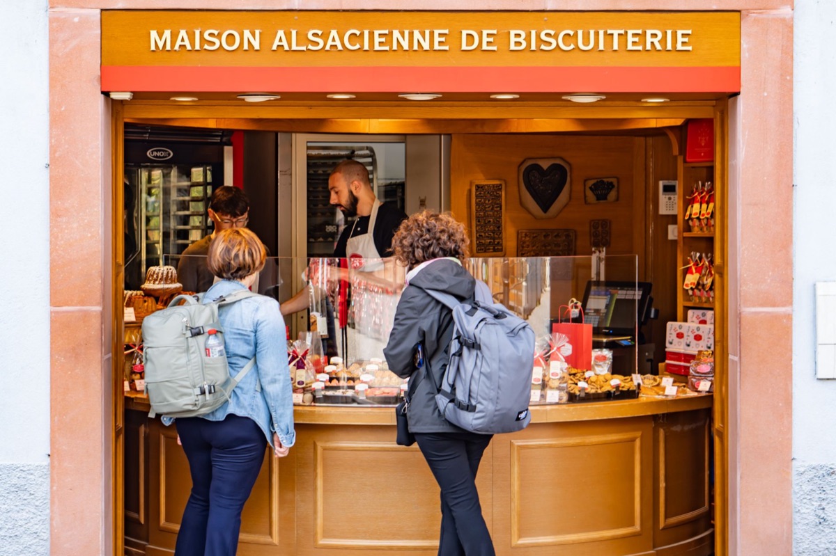 Bakery window with pastries and Parisian street