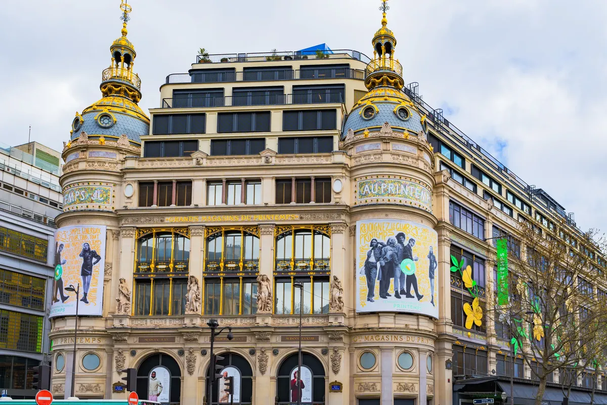 A vibrant view of the iconic Printemps department store in Paris showcasing its ornate architecture.
